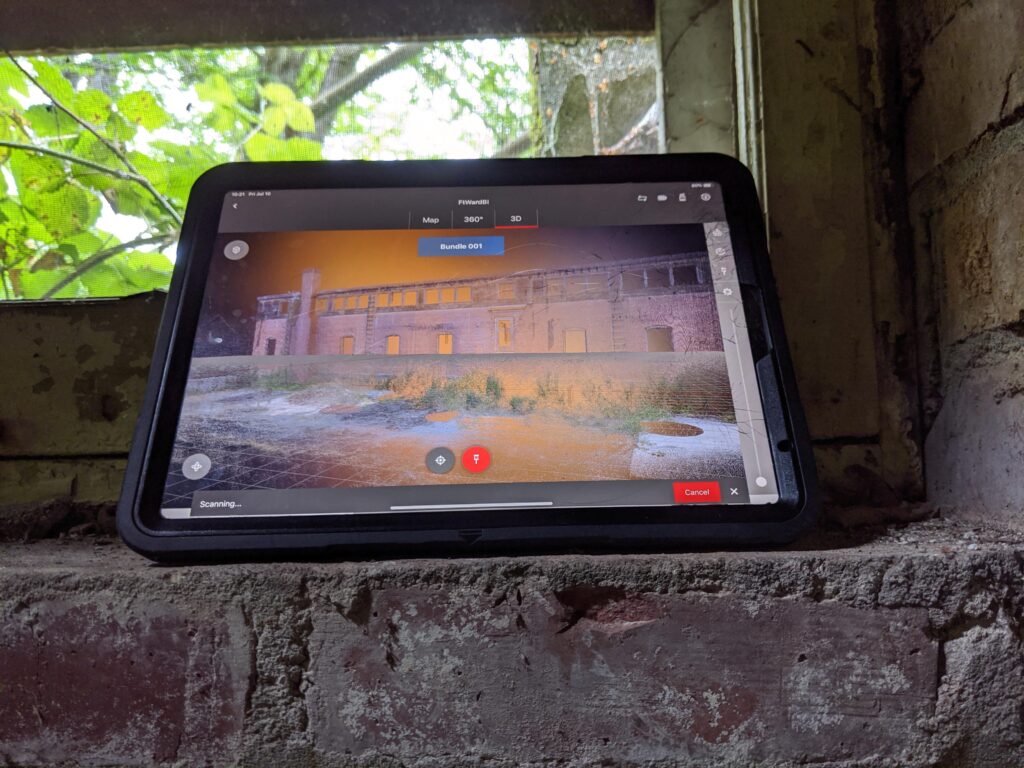 A GTEC3D team member using a Leica FIELD 360 app on an iPad Pro to capture 3D laser scan data inside the Code 13 Building on Bainbridge Island.