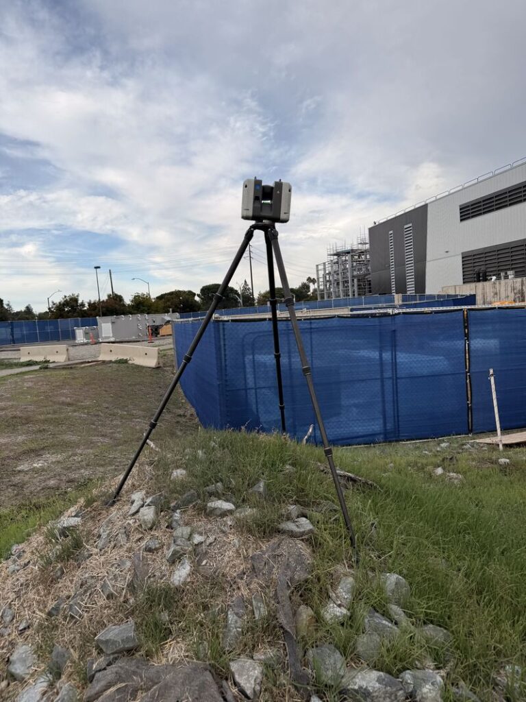 Leica RTC360 laser scanner positioned on a dirt hill for improved site visibility during a GTEC3D scanning project.