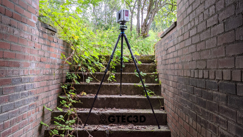A GTEC3D technician operates a Leica RTC360 3D laser scanner to capture data from the exterior of the historic "Station S" naval listening station building at Fort Ward, Washington.