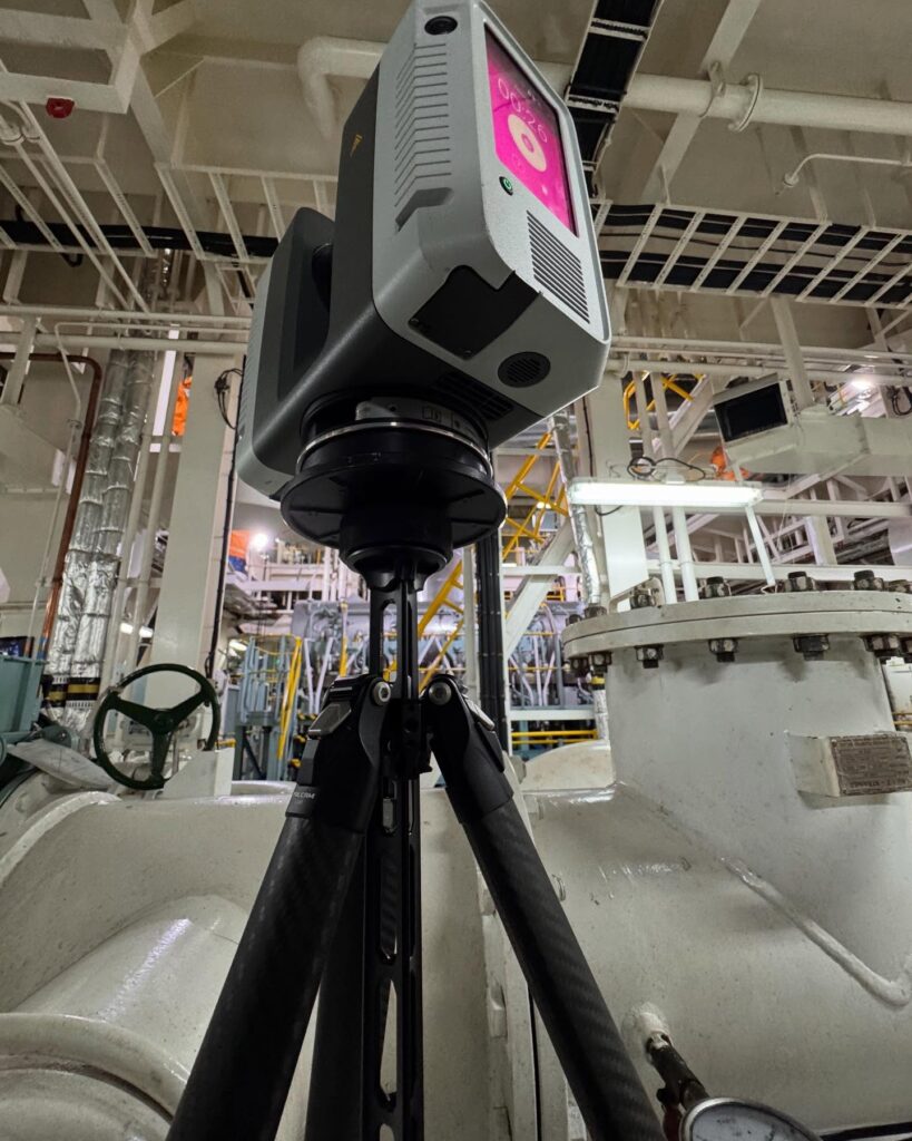 A GTEC3D technician uses a high-precision laser scanner on a vessel along the Mississippi River in New Orleans to capture as-built data for a ballast water replacement system.