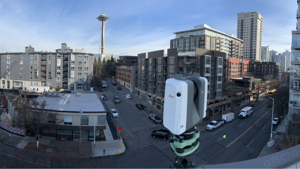 GTEC3D technician using a Leica RTC360 laser scanner to capture high-precision 3D data in downtown Seattle.